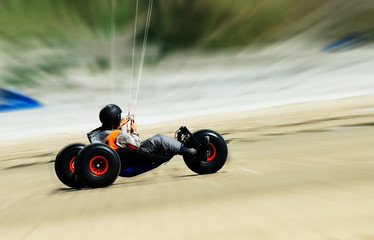 kite buggy going fast on the beach
