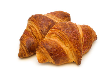 two fresh croissants on white background