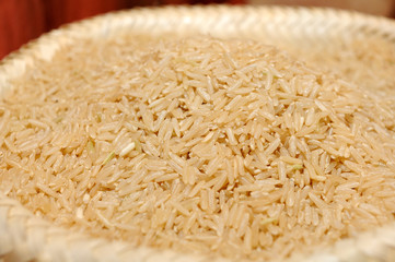 Close up of raw brown rice in sack