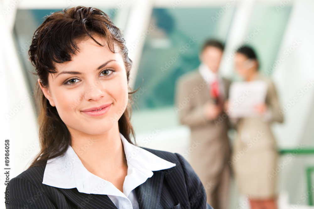 Wall mural Portrait of pretty business leader in working environment