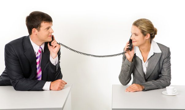 Portrait of business partners speaking on the telephone