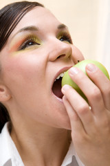 attractive brunette woman with apple