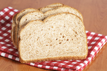 A slices of bread on square mat. Shallow depth of field