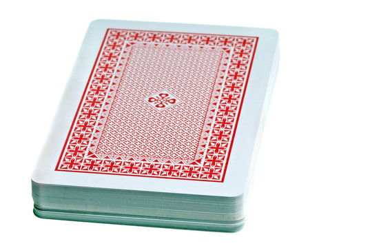 desk stack of playing cards isolated on white