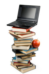 Pile of books, notebook and apple on a white background.