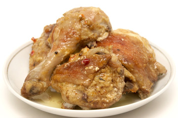 Grilled chicken on a white plate