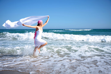 happy scarf lady on the beach