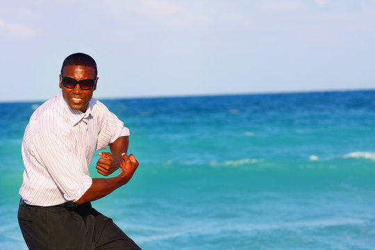 Man Flexing On The Beach