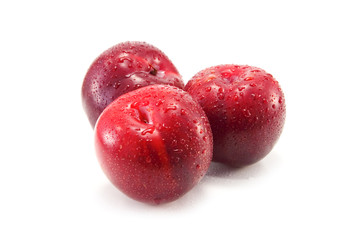 three plum isolated on white background