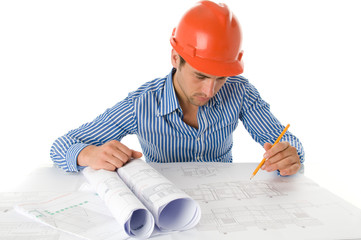 Portrait of young architect working with technical drawings