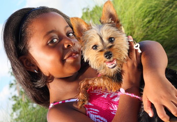 Young child with a cute Yorkie