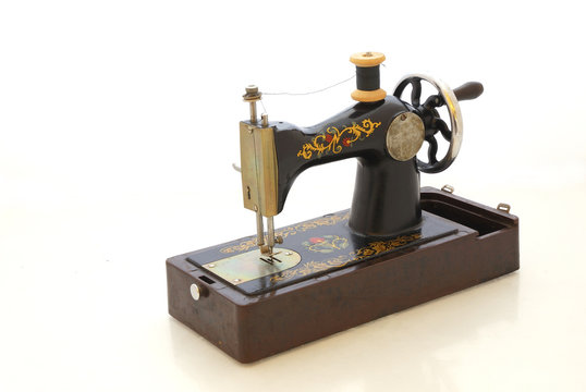 Old sewing machine on a isolated