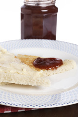 Toast and jam with soft shadow on background. Shallow DOF