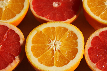 Oranges and red grapefruit halves lying in the chess order.