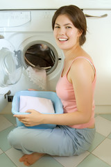 pretty smilng girl in the laundry room