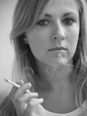 Obraz premium portrait of smoking girl with cigarette at hand