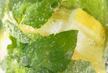 lime and mint at mojito covered with air bubbles
