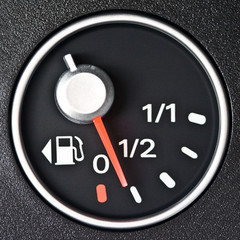 A gas gauge shows almost low petrol level