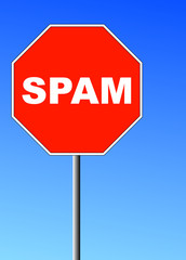 red stop sign shape with the word spam on it against blue sky