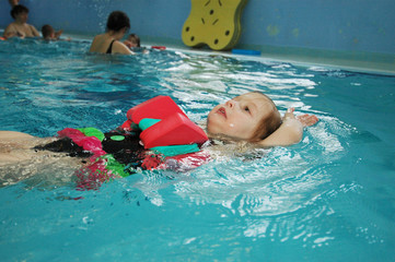 A little girl in swimming pool