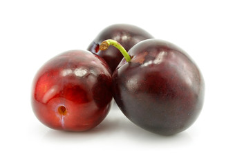 three plum fruit isolated on white background
