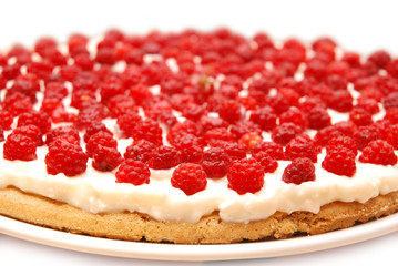 Appetizing raspberry tart on white plate.
