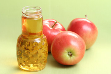 Fototapeta na wymiar bottle of apple juice and some fresh apples