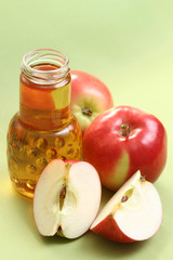 bottle of apple juice and some fresh apples