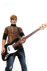 Portrait of young trendy hispanic male playing bass guitar