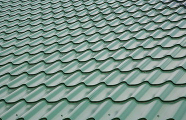View of the roof covered by green tile