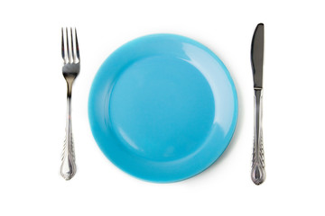 a set of metal fork and knife and blue plate