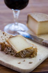 A french tasty slice of cheese on a piece of bread with cereals