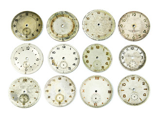 Collection of antique watch faces isolated on white.