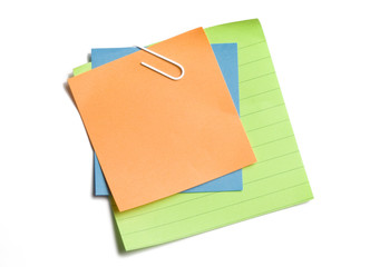 Clipped stacked sticky notes on white background