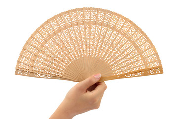 Wood fan in woman hand isolated on white background