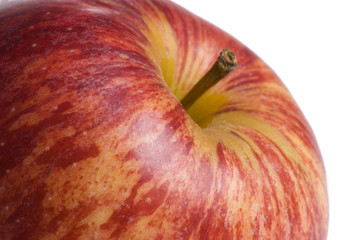 Close up of vibrant red apple on white background