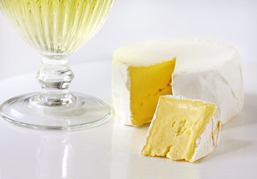 Soft brie cheese, with a glass of white wine.