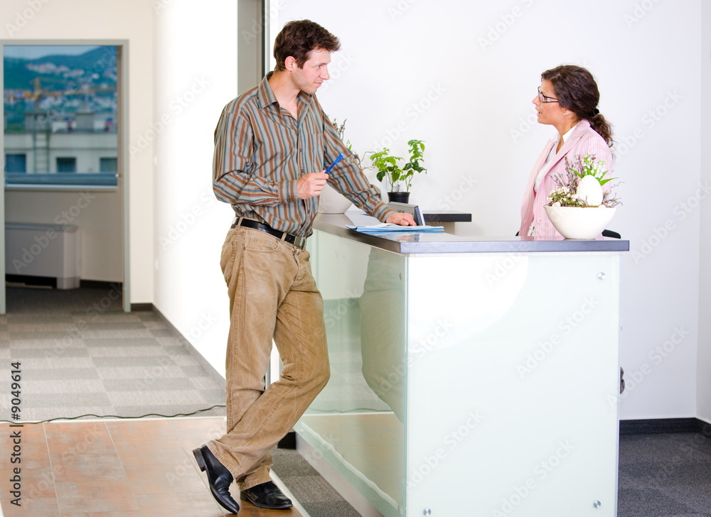 Canvas Prints Young businesspeople talking at office reception.