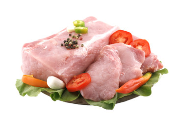 raw cutlet decorated with vegetables