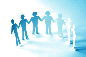 paper team linked together partnership concept