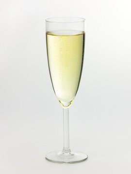 A Champagne glass with Champagne on white background