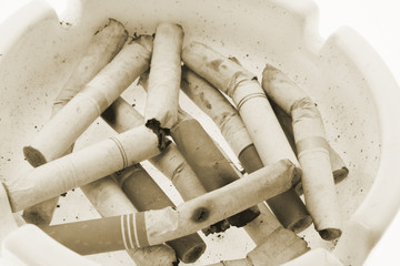 Close Up of Cigarette Butts on Ash Tray
