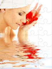puzzle of lovely woman with red flower petals in water