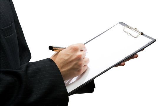 Businessman holding a clipboard and writing in it, isolated