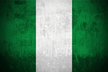 Naklejka premium Weathered Flag Of Nigeria, fabric textured..
