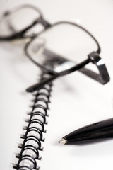 Business Team: image of glass on page with spiral