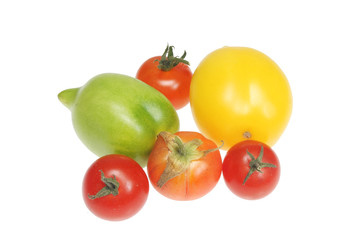 Group of home grown tomatos isolated on white