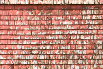 Naklejka premium Old weathered red barn, detail of peeling shingles