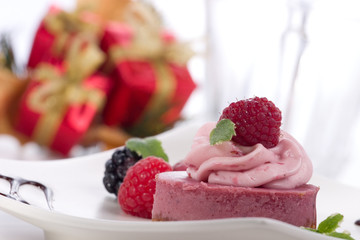 raspberry cheesecake with fresh raspberries, blackberries