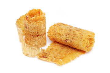 Dried and baked cuttlefish scroll on white background.
